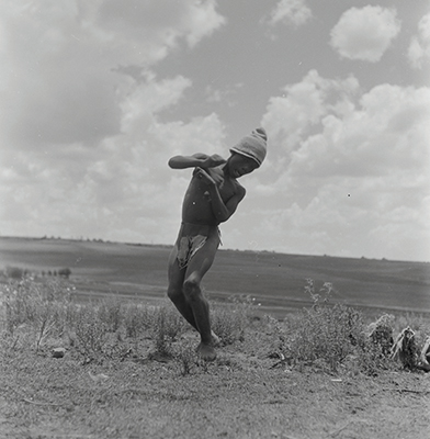 Creator:  Larrabee; Constance Stuart; 1914-2000; Produced:  1941 Phys. Descri  negative : b&w ; 6 x 6 cm. (silver gelatin). photographic print : b&w ; 8 x 10 in. (dupe print).; Subject Geog  South Africa Lesotho   Subjects:  Sotho (Basuto)  Form/Genre  Photographic prints; EEPA 1998-062657; [Summary:  Sotho Herd Boy; 1941. Photographic image of a boy jumping in mid-air. He is wearing a hat and loincloth. Photograph by Constance Stuart Larrabee; 1941. Constance Stuart took photographs in Basutoland (now Lesotho) during her first trip in 1941. In 1947; she returned to Lesotho as an officially accredited photographer. She documented a visit of the British royal family: King George VI; Queen Elizabeth and their daughters Princess Elizabeth and Margaret; to this British Protectorate. She used the occasion to venture into the countryside and captured unique images of rural life among the Sotho people. 
 