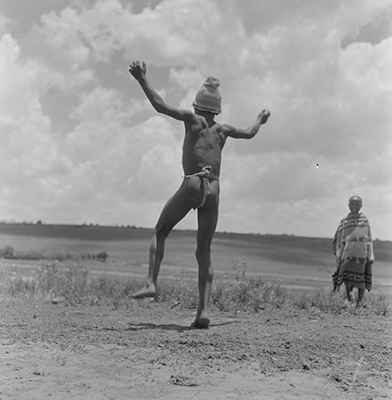 Creator:  Larrabee; Constance Stuart; 1914-2000; Produced:  1941 Phys. Descri  negative : b&w ; 6 x 6 cm. (silver gelatin). photographic print : b&w ; 8 x 10 in. (dupe print).; Subject Geog  South Africa Lesotho   Subjects:  Sotho (Basuto)  Form/Genre  Photographic prints; EEPA 1998-062657; [Summary:  Sotho Herd Boy; 1941. Photographic image of a boy jumping in mid-air. He is wearing a hat and loincloth. Photograph by Constance Stuart Larrabee; 1941. Constance Stuart took photographs in Basutoland (now Lesotho) during her first trip in 1941. In 1947; she returned to Lesotho as an officially accredited photographer. She documented a visit of the British royal family: King George VI; Queen Elizabeth and their daughters Princess Elizabeth and Margaret; to this British Protectorate. She used the occasion to venture into the countryside and captured unique images of rural life among the Sotho people. 
 